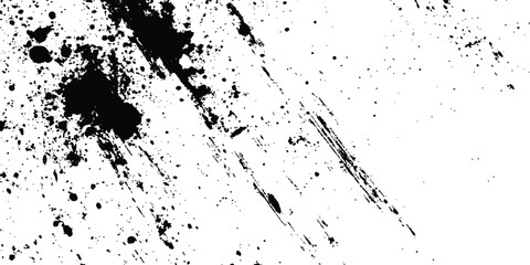 Abstract ink splatter background with black and white textures. A dynamic and chaotic effect, movement with different sizes of spots, splashes, drips, drops and smudges. Isolated on white background. 