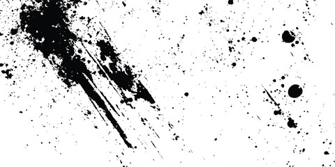 Abstract ink splatter background with black and white textures. A dynamic and chaotic effect, movement with different sizes of spots, splashes, drips, drops and smudges. Isolated on white background. 