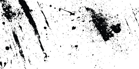 Abstract ink splatter background with black and white textures. A dynamic and chaotic effect, movement with different sizes of spots, splashes, drips, drops and smudges. Isolated on white background. 