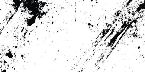 Abstract ink splatter background with black and white textures. A dynamic and chaotic effect, movement with different sizes of spots, splashes, drips, drops and smudges. Isolated on white background. 