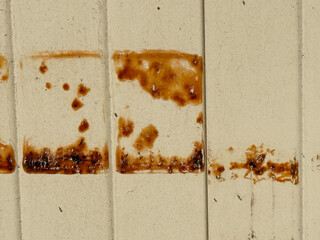 A wall with brown stains on it