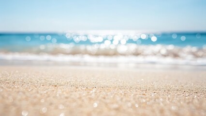 Serene beach scene with shimmering water and soft sandy shore.