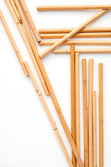 Minimal Bamboo Sticks Arrangement on White, Eco Friendly Wooden Utensils Flat Lay