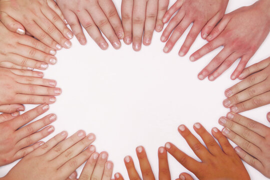 children of different nationalities put their hands together on a white background in the shape of a heart - Powered by Adobe