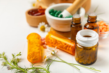 Alternative medicine herbal capsule organic drug on wooden background.Assortment of herbal and...
