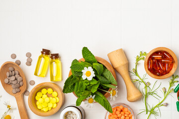 Alternative medicine herbal capsule organic drug on wooden background.Assortment of herbal and...