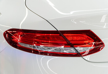 LED turn signal in the rear brake light of the car. Modern car lantern, close-up. Detail on the...