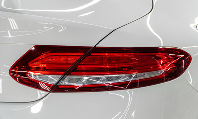 LED turn signal in the rear brake light of the car. Modern car lantern, close-up. Detail on the...