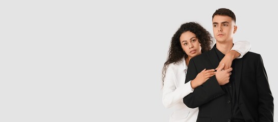 Young couple hugging on white background with space for text. Yin Yang concept