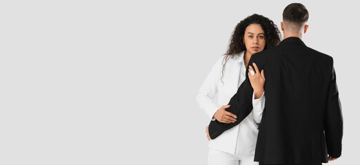 Young stylish couple on white background with space for text. Yin Yang concept