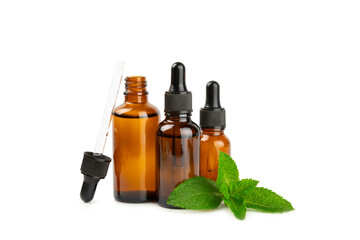 Essential oil mint isolated on white background. Peppermint essential oil with fresh mint leaves. A bottle of aromatherapy oil. Mint extract. The concept of natural cosmetics, spa care