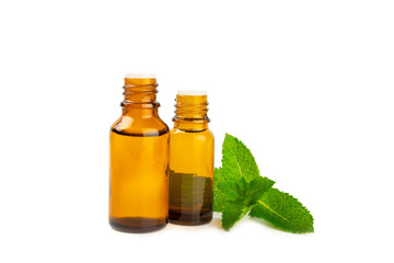 Essential oil mint isolated on white background. Peppermint essential oil with fresh mint leaves. A...