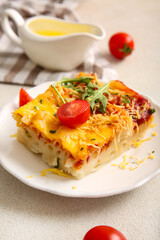 Plate of pasta with tomato sauce and cheese, closeup