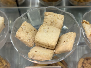A bowl of cookies sits on a counter