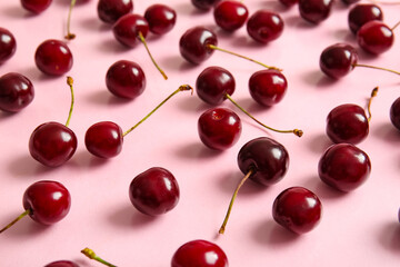 Many sweet cherries on pink background