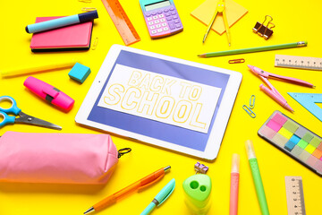 Card with text BACK TO SCHOOL, different stationery and tablet on yellow background