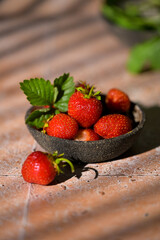 Cup filled with fresh strawberries. Seasonal summer berries, healthy dessert or snack.