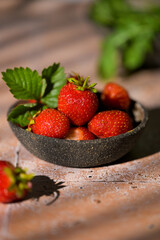Cup filled with fresh strawberries. Seasonal summer berries, healthy dessert or snack.