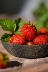 Cup filled with fresh strawberries. Seasonal summer berries, healthy dessert or snack.
