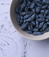 Close-up macro shot of honeysuckle berries. Healthy blue edible berries, rich in antioxidants and vitamins.