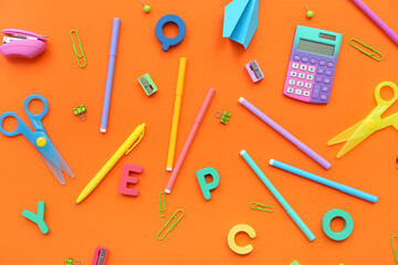 Composition with different stationery and letters on color background