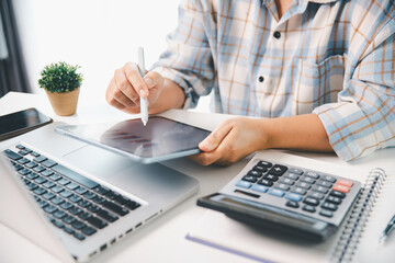 Accountant working on desk using calculator for calculate finance report in office. business...