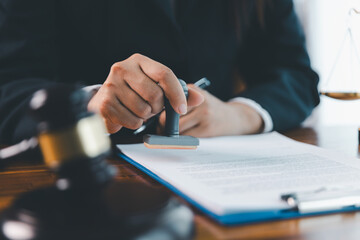Justice and lawfirm concept. Female lawyer in office with brass scale. Woman hand gavel to bang....