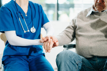ng hands takFemale hands touching old male hand Helpie care of the elderly concept.