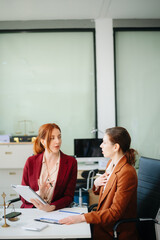Fototapeta premium Business and lawyers discussing contract papers with brass scale on desk in office. Law, legal services, advice, justice and law
