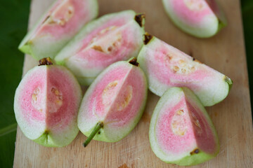 Fresh ripe guava fruit on cutting board