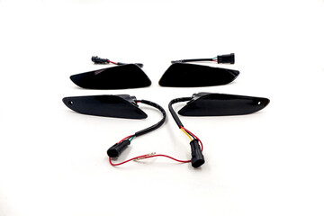 a set of front and rear motorcycle turn signals, isolated on white background