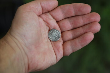 Medieval silver polish coin in hand