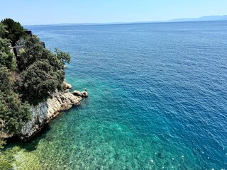 The view of the Mediterranean Sea from above in Rijeka Croatia with a small rocky bay