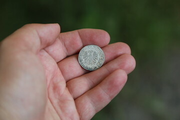 Medieval silver polish coin in hand