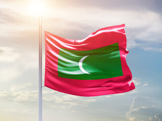 Maldives national flag waving in an amazing sunlight. National flag waving on mast.