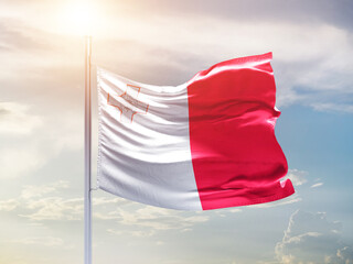 Malta national flag waving in an amazing sunlight. National flag waving on mast.