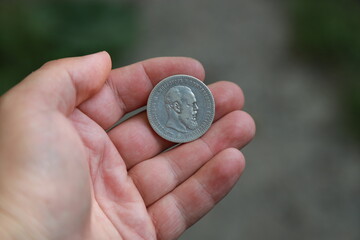 Silver coin one ruble of Russian Empire in hand