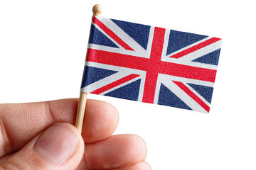 A small hand holds a toothpick flag of the United Kingdom, symbolizing national pride and identity.