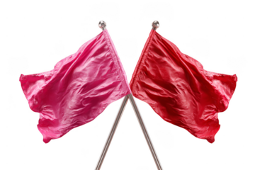 Two red flags crossed at their poles, showcasing vibrant colors and flowing fabric texture.