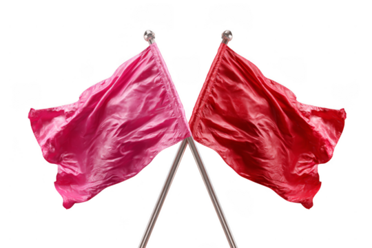Two red flags crossed at their poles, showcasing vibrant colors and flowing fabric texture.