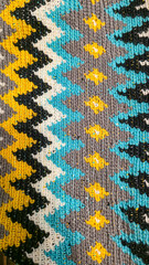 Crochet pattern of multicolored threads Yellow with gray, black and other colors
