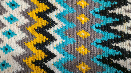 Crochet pattern of multicolored threads Yellow with gray, black and other colors