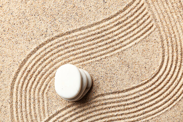 Stones on sand with lines