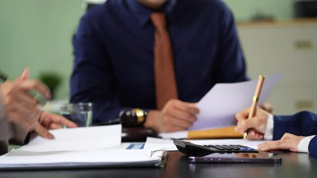 Lawyer working on a monograph in courtroom.