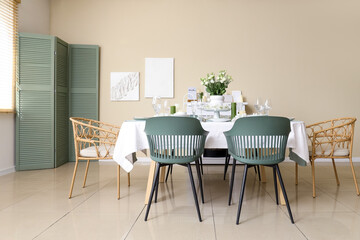 Beautiful table setting with white flowers for wedding celebration in room