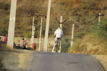 old man riding a bike