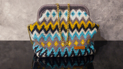Bag crocheted from multi-colored threads Yellow with gray black and other colors
