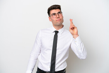 Business caucasian man isolated on white background with fingers crossing and wishing the best