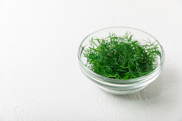 Dill on wooden background. Fresh organic greens. Dill plantation. Cut dill leaves. Bunch of spring...