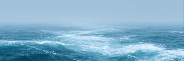 Fototapeta premium Vast cerulean waves dance beneath a shroud of mist, evoking Ocean Day serenity and Neptune's mythic whispers